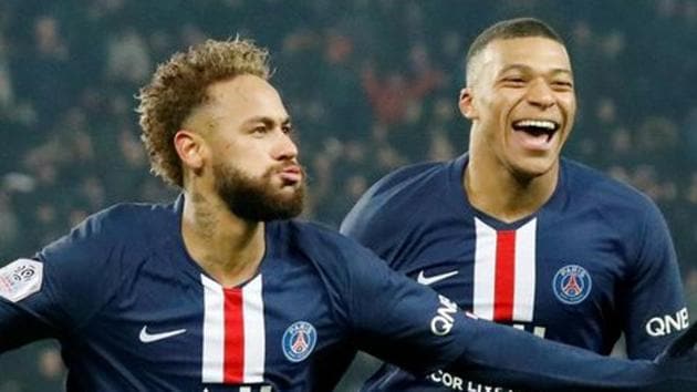 Paris St Germain's Neymar celebrates with Kylian Mbappe.(REUTERS)