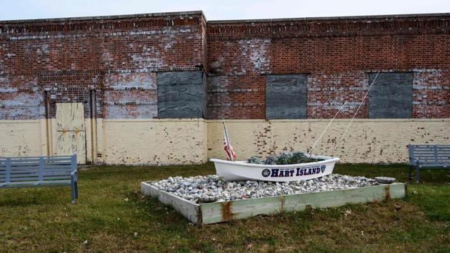 A dinghy sits near the ferry dock and greets visitors. Several nationalities are among the dead noted Justin von Bujdoss, a prison chaplain who gave AFP a guided tour. “Hart Island represents a cross section of the diversity of New York City, which is why it really ought to be considered sacred ground,” he explained. Between 40 and 50 exhumations happen every year after relatives trace a loved one and opt to rebury them privately.  (Don Emmert / AFP) 