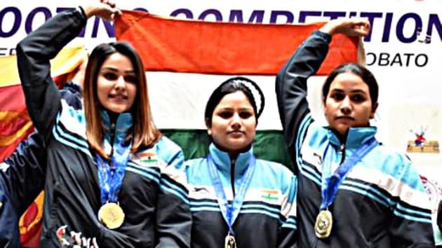 India's Gauri Sheoran, Neeraj Kaur and Annu Raj Singh hold the national flag.(ANI)