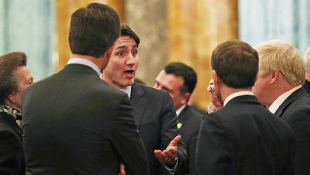 Princess Anne, Princess Royal (far left) talks to (L-R) NATO Secretary General Jens Stoltenberg (back to camera), Canadian PM Justin Trudeau, French President Emmanuel Macron (back to camera) and British PM Boris Johnson during a reception for NATO leaders at Buckingham Palace in London, England. Trudeau was filmed describing how surprised US officials appeared to be by Trump’s performance at an earlier news conference. (Yui Mok - WPA Pool / Getty Images)