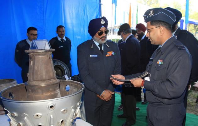 (Air Marshal RKS Shera (left), air force commanding-in chief, maintenance command, being briefed about products at 3BRD depot, Air Force station in Chandigarh on Friday.)
