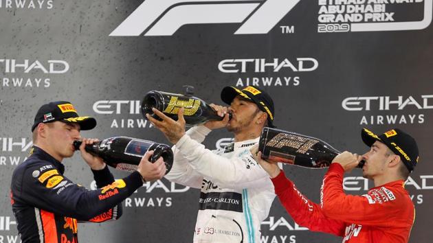 Mercedes’ Lewis Hamilton celebrates after winning the race with second placed Red Bull’s Max Verstappen and third placed Ferrari’s Charles Leclerc during the Formula 1 Abu Dhabi grand Prix at the Yas Marina Circuit, Abu Dhabi, United Arab Emirates. (Hamad I Mohammed / REUTERS)