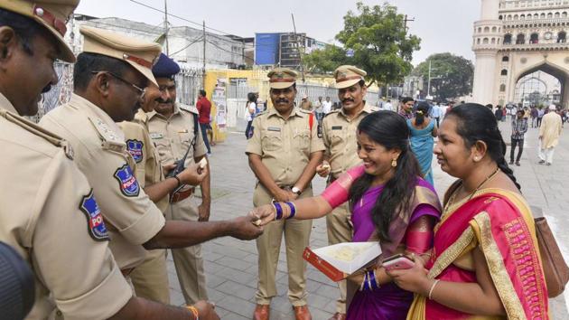 Women offer sweet to policemen as they commend the Hyderabad Police for its strong action against the four accused in the gang rape and murder of a 25-year-old veterinarian, in Hyderabad. (PTI) Women offer sweet to policemen as they commend the Hyderabad Police for its strong action against the four accused in the gang rape and murder of a 25-year-old veterinarian, in Hyderabad. (PTI)