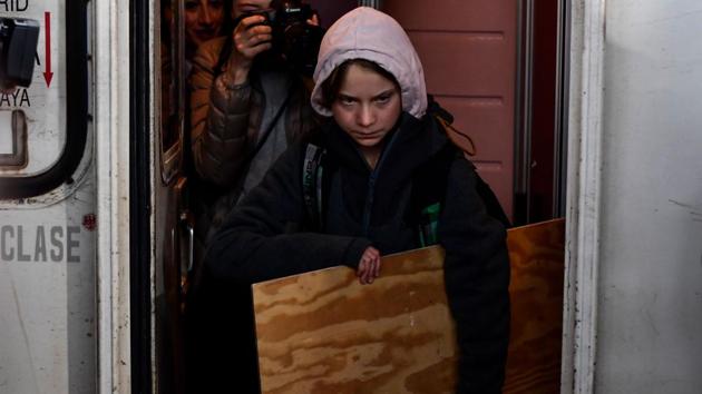 Swedish climate activist Greta Thunberg arrives by train from Lisbon to the Atocha train station in Madrid, Spain prior to taking part in a mass climate march on the sidelines of the COP25 Climate Change Conference. (Oscar Del Pozo / AFP)