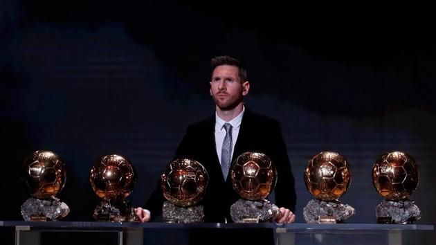 Barcelona’s Lionel Messi with his record six Ballon d’Or trophies during this year’s award ceremonies at the Theatre du Chatelet in Paris, France. (Christian Hartmann / REUTERS)