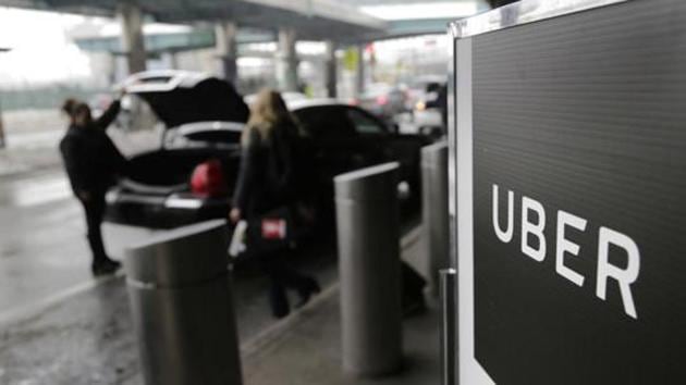 A sign marks a pick up point for the Uber car service at LaGuardia Airport in New York. Image used for representational purpose only. (File photo: AP) A sign marks a pick up point for the Uber car service at LaGuardia Airport in New York. Image used for representational purpose only. (File photo: AP)