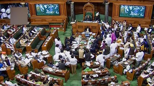 Opposition members protest in the Lok Sabha during the Winter Session of Parliament, in New Delhi, Monday.(PTI) Opposition members protest in the Lok Sabha during the Winter Session of Parliament, in New Delhi, Monday.(PTI)