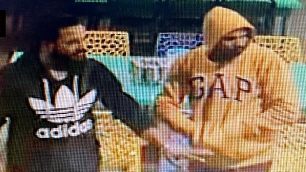 The man (in black shirt) who posed as an Army officer and fled with two INSAS assault rifles belonging to the sentries guarding the Army Education Corps (AEC) Training Centre in Pachmari, on Dec 5 night , was caught on CCTV of a restaurant later. (ANI / Twitter) The man (in black shirt) who posed as an Army officer and fled with two INSAS assault rifles belonging to the sentries guarding the Army Education Corps (AEC) Training Centre in Pachmari, on Dec 5 night , was caught on CCTV of a restaurant later. (ANI / Twitter)