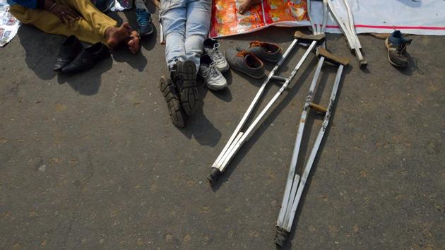 Walking sticks are seen on the ground as differently abled railway applicants continue their protest for the 9th consecutive day against Railway Ministry, at Mandi House circle, in New Delhi. (Amal KS / HT Photo) Walking sticks are seen on the ground as differently abled railway applicants continue their protest for the 9th consecutive day against Railway Ministry, at Mandi House circle, in New Delhi. (Amal KS / HT Photo)