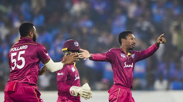 West Indies bowler Khary Pierre with teammates celebrates the dismissal. (PTI) West Indies bowler Khary Pierre with teammates celebrates the dismissal. (PTI)