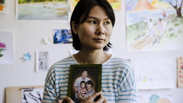 In this Wednesday, May 9, 2018 file photo, Hua Qu, the wife of detained Chinese-American Xiyue Wang, poses for a photograph with a portrait of her family in Princeton, N.J. Iran's foreign minister says a detained Princeton graduate student will be exchanged for an Iranian scientist held by the U.S. Mohammed Javad Zarif made the announcement on Twitter on Saturday. The trade involves graduate student Xiyue Wang and scientist Massoud Soleimani. Wang was sentenced to 10 years in prison in Iran for allegedly “infiltrating” the country and sending confidential material abroad. His family and Princeton strongly denied the claims. (AP) In this Wednesday, May 9, 2018 file photo, Hua Qu, the wife of detained Chinese-American Xiyue Wang, poses for a photograph with a portrait of her family in Princeton, N.J. Iran's foreign minister says a detained Princeton graduate student will be exchanged for an Iranian scientist held by the U.S. Mohammed Javad Zarif made the announcement on Twitter on Saturday. The trade involves graduate student Xiyue Wang and scientist Massoud Soleimani. Wang was sentenced to 10 years in prison in Iran for allegedly “infiltrating” the country and sending confidential material abroad. His family and Princeton strongly denied the claims. (AP)