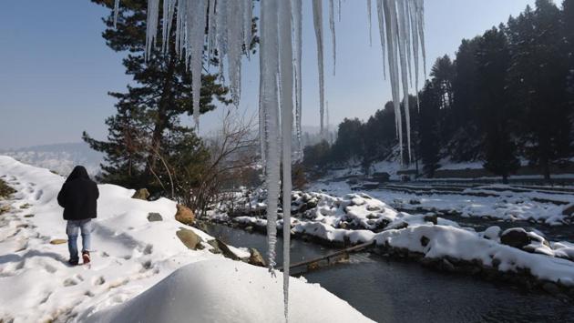 A man walks near a bridge as icicles are seen, at Drung region of Tangmarg, about 50 kilometre from Srinagar, Jammu and Kashmir. Mercury in the region has plummetted to sub-zero degrees Celsius during the nights. (Waseem Andrabi / HT Photo) A man walks near a bridge as icicles are seen, at Drung region of Tangmarg, about 50 kilometre from Srinagar, Jammu and Kashmir. Mercury in the region has plummetted to sub-zero degrees Celsius during the nights. (Waseem Andrabi / HT Photo)
