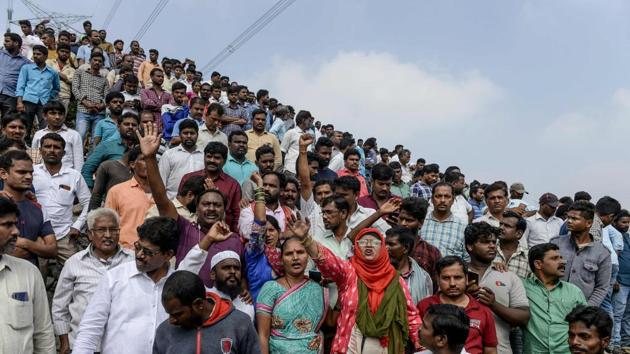 People shout slogans as they gather near the site where police shot dead four detained gang-rape and murder suspects in Shadnagar, Hyderabad. Police shot dead four detained gang-rape and murder suspects as they were re-enacting their alleged crime, prompting outrage but also wild celebrations. (Noah Seelam / AFP) People shout slogans as they gather near the site where police shot dead four detained gang-rape and murder suspects in Shadnagar, Hyderabad. Police shot dead four detained gang-rape and murder suspects as they were re-enacting their alleged crime, prompting outrage but also wild celebrations. (Noah Seelam / AFP)