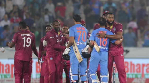 West Indies' captain Kieron Pollard, right, hugs India's captain Virat Kohli after India's win during their first Twenty20 international match in Hyderabad.(AP)