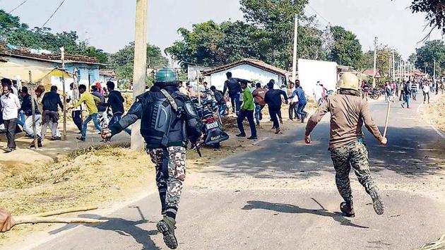 Security forces trying to control the situation after clashes between two political parties workers at Baghni polling booth during the second phase of Jharkhand Assembly Election-2019, in Sisai block under Gumla district of Jharkhand. (PTI Photo) Security forces trying to control the situation after clashes between two political parties workers at Baghni polling booth during the second phase of Jharkhand Assembly Election-2019, in Sisai block under Gumla district of Jharkhand. (PTI Photo)