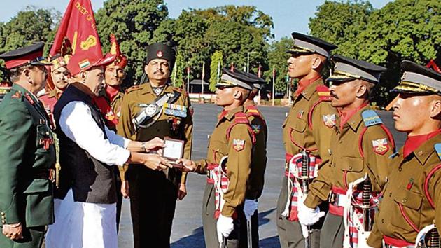 Defence minister Rajnath Singh presents medals to cadets during passing out parade of Indian Military Academy in Dehradun.(ANI)