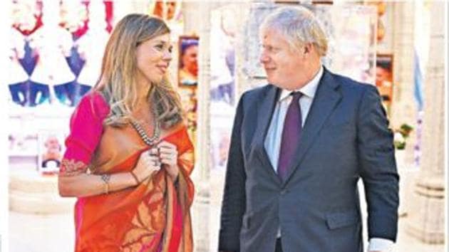 Prime Minister Boris Johnson with his partner Carrie Symonds in a sari in a London temple.(THE SUNDAY TELEGRAPH.) Prime Minister Boris Johnson with his partner Carrie Symonds in a sari in a London temple.(THE SUNDAY TELEGRAPH.)