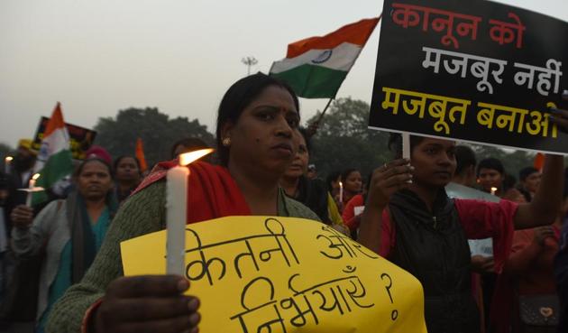 Protestors hold placards to demand justice for the rape and murder of the Unnao rape victim who was burnt alive by her alleged rapists, at Shahidi Park, ITO, in New Delhi, India, on Saturday, December 07, 2019. (Sonu Mehta/HT PHOTO) Protestors hold placards to demand justice for the rape and murder of the Unnao rape victim who was burnt alive by her alleged rapists, at Shahidi Park, ITO, in New Delhi, India, on Saturday, December 07, 2019. (Sonu Mehta/HT PHOTO)