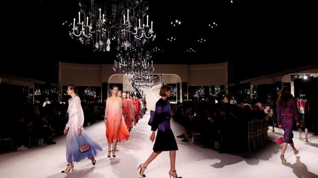 Models present creations during the Metiers D'Art Show for Chanel fashion house. (REUTERS)