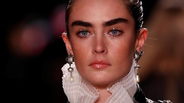 A model presents a creation during the Metiers D'Art Show for Chanel fashion house. (REUTERS)