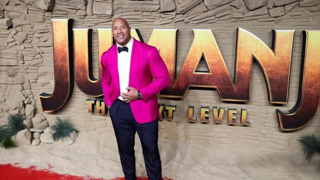 Dwayne Johnson poses as he arrives to the premiere of Jumanji: The Next Level in London, Britain December 5, 2019.(REUTERS)