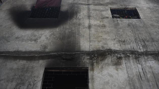 A section of the five-storey building where the fire broke out. The building housed at least five different unlicenced units manufacturing bags, plastic toys and jackets, and employed roughly 70 workers who also slept on the floor at night. The building had only a few windows and just one narrow entrance, effectively turning the structure — built in a cramped neighbourhood with serpentine lanes — into an inferno around 5 am. (Sanchit Khanna / HT Photo)