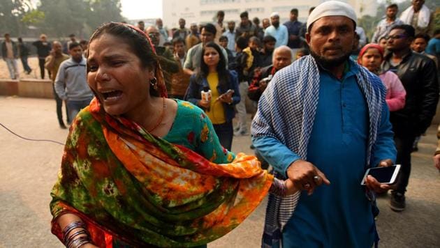 Noorjahan and Kalam look for their relatives at the Lok Nayak hospital on Sunday. Forty three people died in a massive fire that broke out in an illegal factory in north Delhi’s congested Anaj Mandi early on Sunday, the worst blaze in 20 years that exposed shoddy city planning and lax enforcement of fire safety rules in the national capital. Grieving relatives continue to throng the hospital to recover the bodies of their kin. (Amal KS / HT Photo)