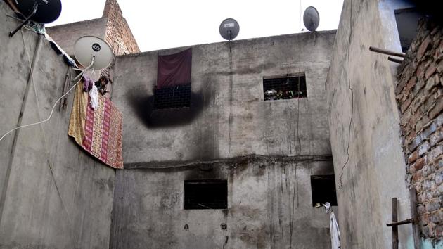 A burnt window from which people were rescued is seen at the backside of the factory after the tragic fire in which at least 43 people lost their lives and several got injuries, at Anaj Mandi in New Delhi on Sunday.(ANI) A burnt window from which people were rescued is seen at the backside of the factory after the tragic fire in which at least 43 people lost their lives and several got injuries, at Anaj Mandi in New Delhi on Sunday.(ANI)