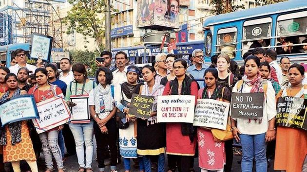 Activists stage a protest against rising rape cases in the country, at Hazra crossing in Kolkata on Monday.