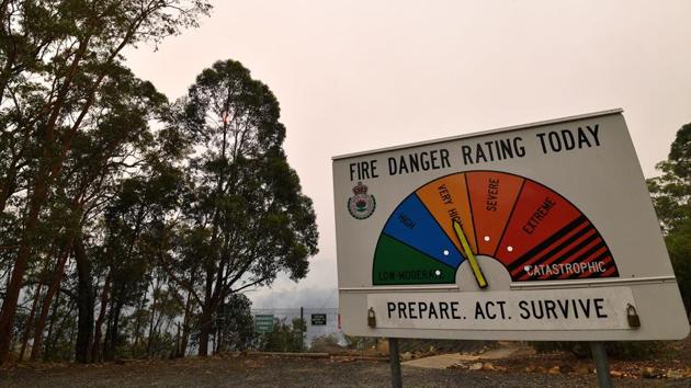 A fire rating display shows high alert as bushfire burn at the Mangrove Dam in Central Coast, some 90-110 kilometres north of Sydney. Bushfires are common in the country but scientists say this year's season has come earlier and with more intensity due to a prolonged drought and climatic conditions fuelled by global warming. (SAEED KHAN / AFP) A fire rating display shows high alert as bushfire burn at the Mangrove Dam in Central Coast, some 90-110 kilometres north of Sydney. Bushfires are common in the country but scientists say this year's season has come earlier and with more intensity due to a prolonged drought and climatic conditions fuelled by global warming. (SAEED KHAN / AFP)