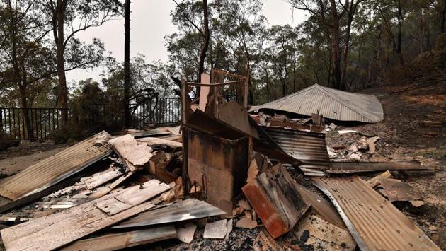 The remains of a property seen after a bushfire at the Mangrove Dam. The wildfires have blanketed Sydney - home to more the 5 million people - in smoke and ash for more than a week, turning the daytime sky orange, obscuring visibility and prompting commuters to wear breathing masks. Australia’s worst bushfires on record destroyed thousands of homes in Victoria state in February 2009, killing 173 people and injuring 414. (SAEED KHAN / AFP) The remains of a property seen after a bushfire at the Mangrove Dam. The wildfires have blanketed Sydney - home to more the 5 million people - in smoke and ash for more than a week, turning the daytime sky orange, obscuring visibility and prompting commuters to wear breathing masks. Australia’s worst bushfires on record destroyed thousands of homes in Victoria state in February 2009, killing 173 people and injuring 414. (SAEED KHAN / AFP)