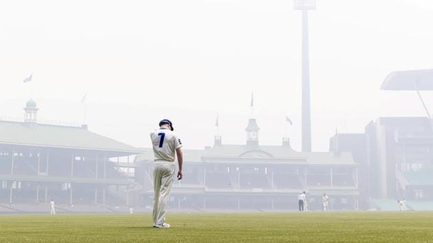 Liam Hatcher of the Blues stands in the outfield amid the smoke haze from bushfires during day 3 of the Sheffield Shield match between New South Wales and Queensland at the SCG in Sydney. (REUTERS) Liam Hatcher of the Blues stands in the outfield amid the smoke haze from bushfires during day 3 of the Sheffield Shield match between New South Wales and Queensland at the SCG in Sydney. (REUTERS)