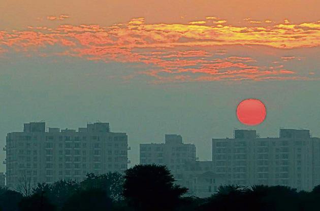 The setting sun paints the sky a vivid crimson in Mohali on Tuesday.(Gurminder Singh/HT) The setting sun paints the sky a vivid crimson in Mohali on Tuesday.(Gurminder Singh/HT)