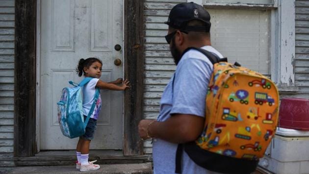 Zayleeana Tiemann, who recently turned 3, tries on her backpack before her first day of school in Seguin, Texas. Zak Tiemann picked up his daughters from school early this Halloween. They were beaming with excitement as they donned their “Frozen” costumes and went trick-or-treating in their small hometown. But for their 34-year old father family occasions have been bittersweet. The girls’ mother, Amanda Garcia, died three years ago just days after giving birth to Zayleeana. She was 26 years old. (Callaghan O'Hare / REUTERS) Zayleeana Tiemann, who recently turned 3, tries on her backpack before her first day of school in Seguin, Texas. Zak Tiemann picked up his daughters from school early this Halloween. They were beaming with excitement as they donned their “Frozen” costumes and went trick-or-treating in their small hometown. But for their 34-year old father family occasions have been bittersweet. The girls’ mother, Amanda Garcia, died three years ago just days after giving birth to Zayleeana. She was 26 years old. (Callaghan O'Hare / REUTERS)