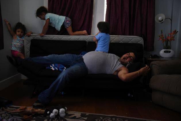 Zak Tiemann rests on the couch while his children play at their home. Tiemann has since fathered a third child, Zay’dyn, 1, with another woman, although he said she is not consistently involved in the care of his two daughters. (Callaghan O'Hare / REUTERS) Zak Tiemann rests on the couch while his children play at their home. Tiemann has since fathered a third child, Zay’dyn, 1, with another woman, although he said she is not consistently involved in the care of his two daughters. (Callaghan O'Hare / REUTERS)