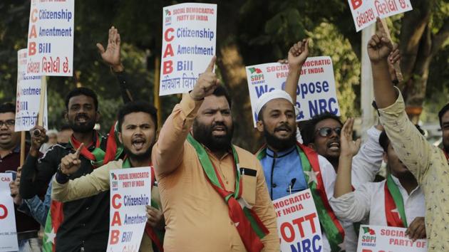 Activists holds placards and shouts slogans during a protest against Citizenship Amendment Bill (CAB) in Ahmadabad. (AP) Activists holds placards and shouts slogans during a protest against Citizenship Amendment Bill (CAB) in Ahmadabad. (AP)