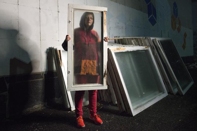 Olga poses with a window frame in a park in Kyiv, Ukraine. After being snatched by pro-separatist militias from her hometown of Alchevsk in August 2014, Olga survived three mock executions and was rescued by her girlfriend 10 days later. In the five years that eastern Ukraine has been embroiled in bloodshed, between 3,000 and 10,000 people, according to different estimates, survived unlawful detentions and captivity. (Zoya Shu / AP)