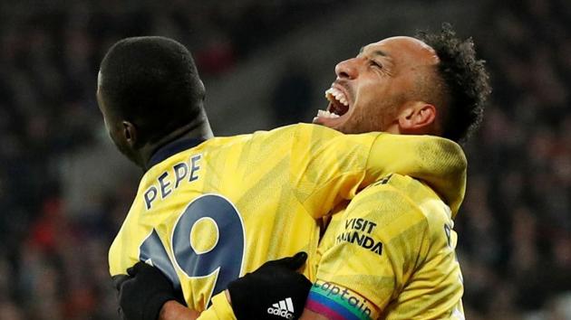 Arsenal's Pierre-Emerick Aubameyang celebrates scoring their third goal.(REUTERS)