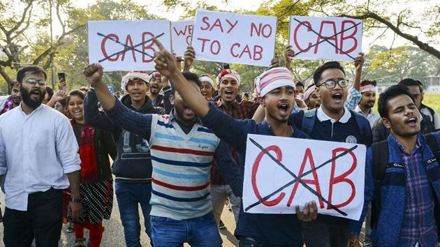 Gauhati University students hold placards as they raise slogans against Citizenship Amendment Bill (CAB), in Guwahati, Monday, Dec. 9, 2019.(PTI)