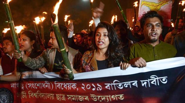 Gauhati University students take part in a torchlight rally during a protest against the Citizenship Amendment Bill, at Jalukbari in Guwahati on Monday. (PTI Photo) Gauhati University students take part in a torchlight rally during a protest against the Citizenship Amendment Bill, at Jalukbari in Guwahati on Monday. (PTI Photo)