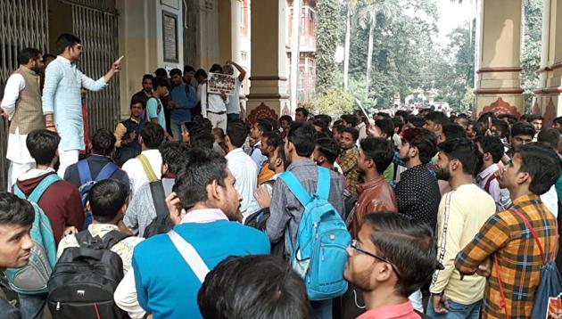 Sanskrit faculty students of BHU stage a dharna inside the campus, in Varanasi on Monday.(ANI file photo)