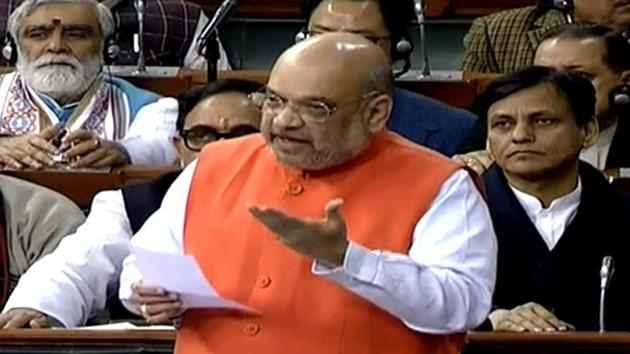 Union Home Minister Amit Shah at Lok Sabha during the winter session of Parliament in New Delhi on Monday.(ANI Photo/LSTV Grab)