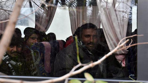 Illegal migrants sit in a bus following their evacuation of the makeshift camp “Vucjak”. According to local reports, several hundred migrants have set out in recent days in last-ditch attempts to enter Croatia and continue westward into the EU. Bosnia’s security minister says migrants who have been moved out of the camp will eventually be housed at a new centre under construction in a former army barracks near Sarajevo. (Elvis Barukcic / AFP)