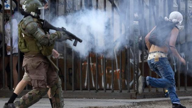 “We’re going to stay here until there are real solutions to the issues that have been raised since the beginning and which have made the government go crazy,” Matias, a masked 27-year-old, from behind a metal shield. He said he was neither an anarchist nor a thief, and not reckless or poor. Rather, he represents the protests’ middle-class university student contingent -- united by the same frustrations and resentment as their more violent peers. (Martin BERNETTI / AFP) “We’re going to stay here until there are real solutions to the issues that have been raised since the beginning and which have made the government go crazy,” Matias, a masked 27-year-old, from behind a metal shield. He said he was neither an anarchist nor a thief, and not reckless or poor. Rather, he represents the protests’ middle-class university student contingent -- united by the same frustrations and resentment as their more violent peers. (Martin BERNETTI / AFP)