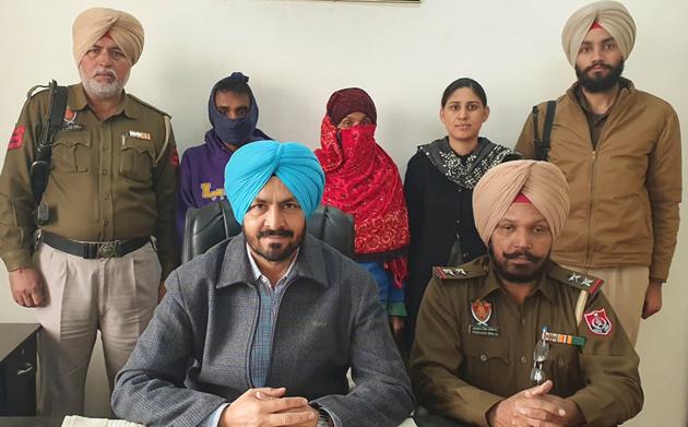 The accused (faces covered) in Ludhiana STF custody on Wednesday. (Harsimar Pal Singh/HT) The accused (faces covered) in Ludhiana STF custody on Wednesday. (Harsimar Pal Singh/HT)