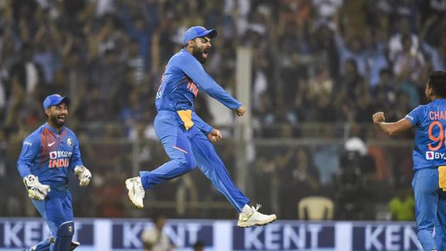 Indian skipper Virat Kohli with teammates celebrates the dismissal of West Indies. (PTI) Indian skipper Virat Kohli with teammates celebrates the dismissal of West Indies. (PTI)