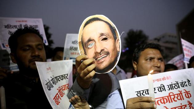 Members of Indian Youth Congress (IYC) holds a cut-out of Uttar Pradesh MLA Kuldeep Singh Sengar during a protest against Uttar Pradesh government over the Unnao rape and burn case, in New Delhi . (Photo: ANI) Members of Indian Youth Congress (IYC) holds a cut-out of Uttar Pradesh MLA Kuldeep Singh Sengar during a protest against Uttar Pradesh government over the Unnao rape and burn case, in New Delhi . (Photo: ANI)