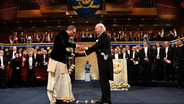 Indian-American economist Abhijit Banerjee shakes hands with Sweden's King Carl Gustaf as he receives the Economic Nobel at a ceremony in Stockholm, on December 10.(Reuters Photo) Indian-American economist Abhijit Banerjee shakes hands with Sweden's King Carl Gustaf as he receives the Economic Nobel at a ceremony in Stockholm, on December 10.(Reuters Photo)