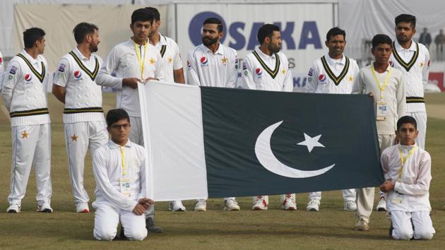 Rawalpindi: Pakistani players stand for national anthem before the start of play.(AP)