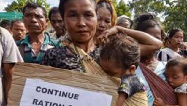 Bru refugees during an indefinite road blockade last month in Tripura demanding resumption of free ration and cash-dole to them,.(PTI)